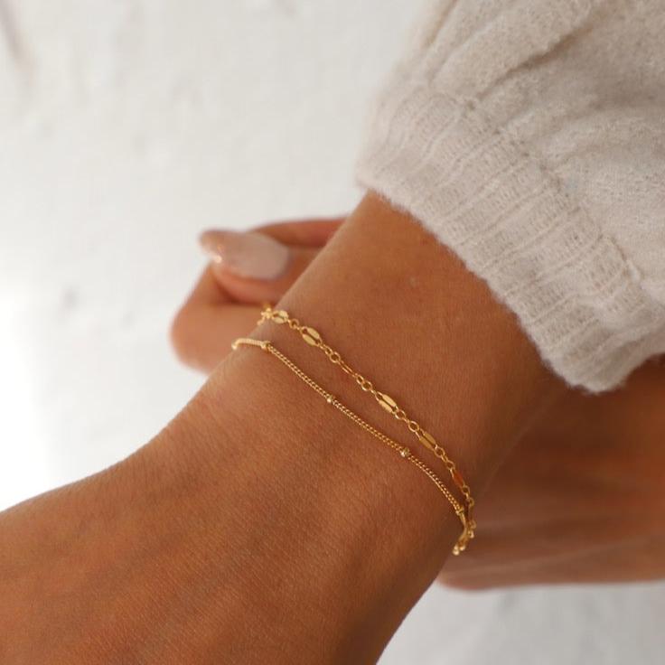 Add flare to your ensemble with this dainty gold filled dapper chain bracelet. The perfect accessory for any outfit, this delicate bracelet will make you stand out in a subtle way. Don't be shy to add a little shimmer and shine to your wardrobe.