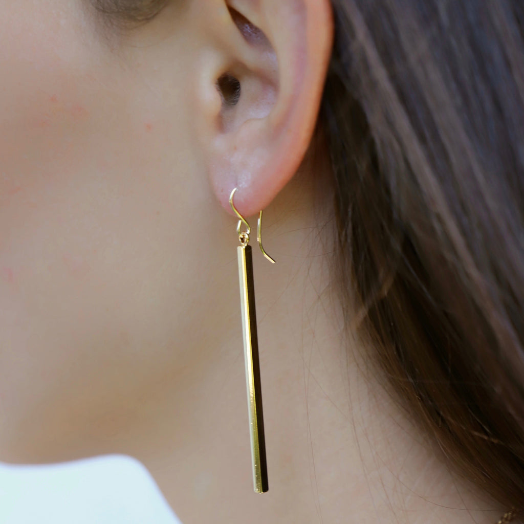 Add a touch of playful elegance with these Long Bar Earrings. The elongated design is perfect for elongating your look and the lightweight construction ensures comfortable wear all day. Elevate any outfit with these quirky and fun earrings!