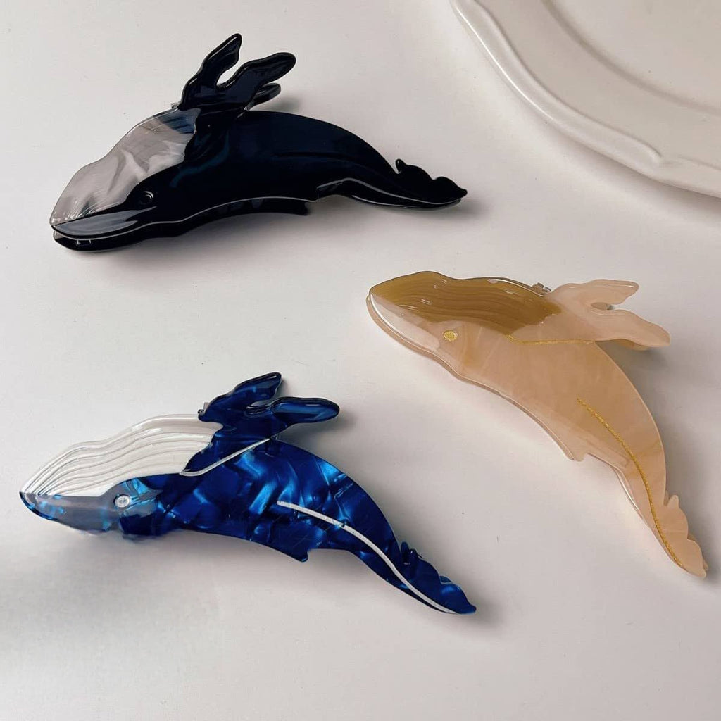 black, blue, and cream acetate whale claw clips