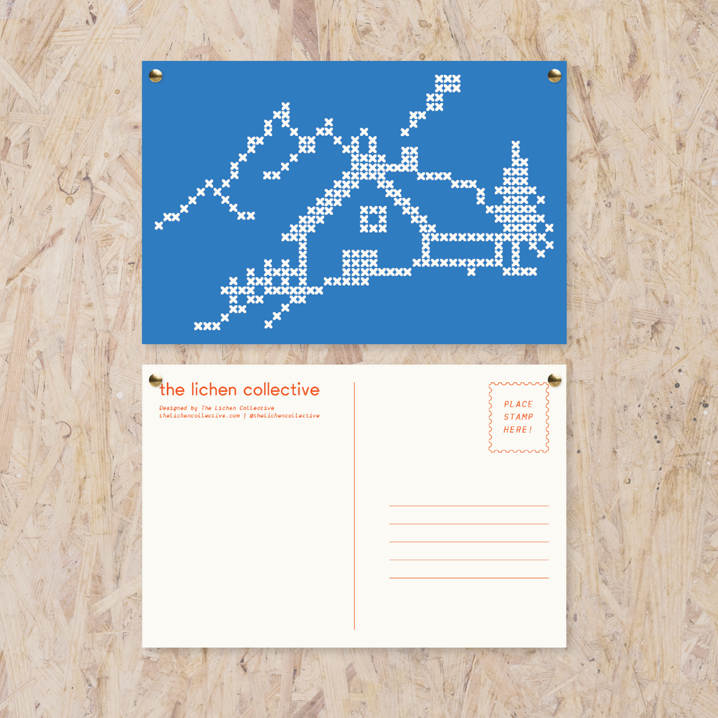 blue postcard with cross stitch-like home in the mountains