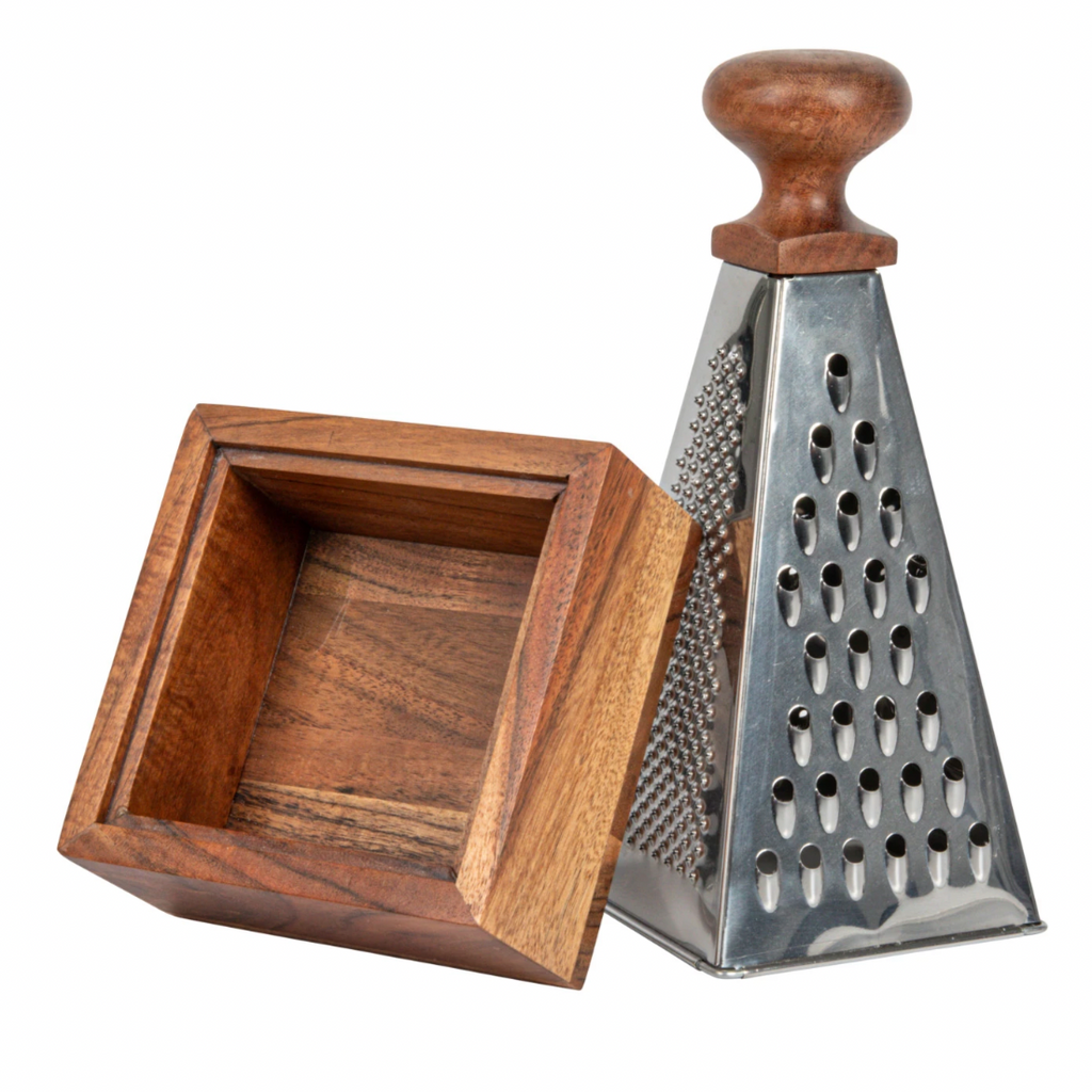 Stainless steel grater with acacia wood handles and square bases offers both functionality and style to every kitchen. Made from stainless steel and acacia wood. Sharp, durable blades for efficient grating, while the acacia wood handles provide a comfortable grip and a touch of natural elegance, and square bases offer stability and support during use, ensuring a secure grating experience. 7"H