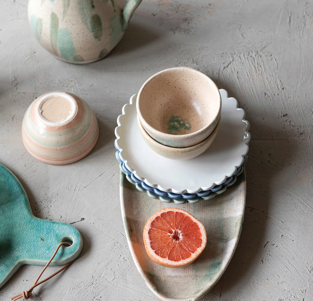 Add a touch of whimsy to your dining experience with our stoneware plate in blue. The scalloped edge adds a playful twist to any meal. Made from durable stoneware, this plate is both functional and charming. Serve up your favorite dishes with style! 8" Round