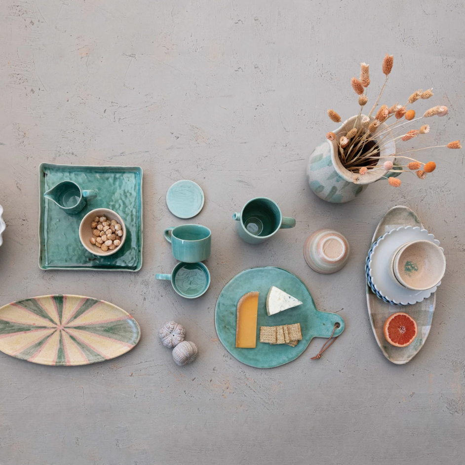 Add a touch of whimsy to your dining experience with this stoneware scalloped edge bowl in blue. The scalloped edge adds a playful twist to any meal. Made from durable stoneware, this bowl is both functional and charming. 10" Round x 4"H