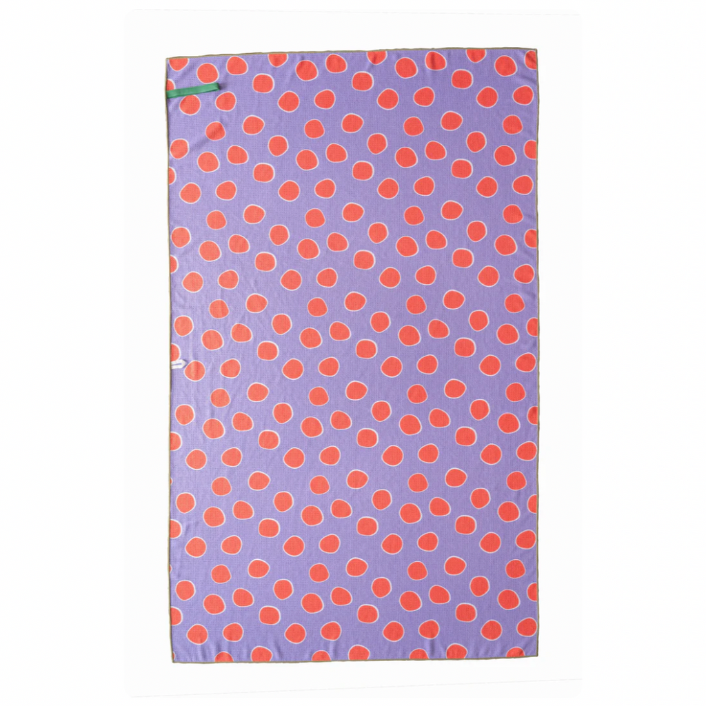 This towel is big on style and size, but small on space.&nbsp; Use the elastic band to keep it compact and take them anywhere you go.  orange circles on one side