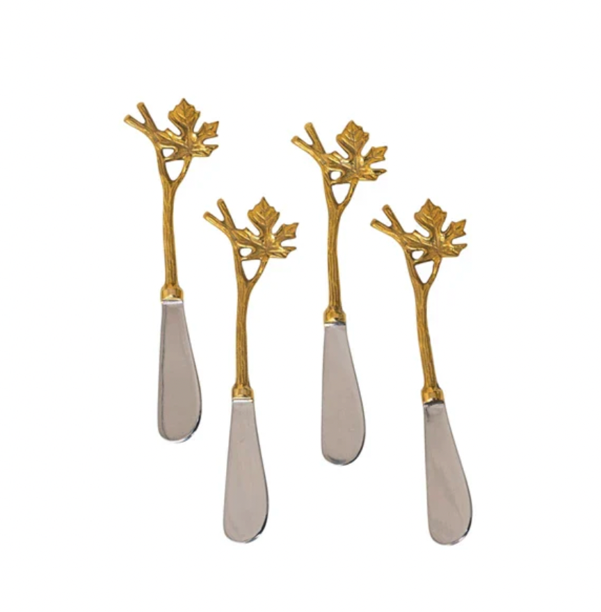 An elegant take on hors d'oeuvres, this stainless steel &amp; brass canape knife with it's Maple Branch handles are sure to be the talk of the party! Perfect for slicing and scooping appetizers, this beauty will charm your guests and make them feel extra special.