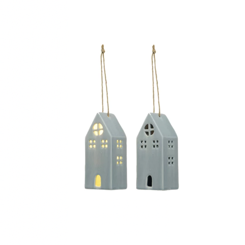 Bring some charm to your home with our blue  Hand-Painted Stoneware House! This unique piece comes with a built-in LED light for a cozy touch. Available in 4 styles, each one is lovingly hand-painted for a one-of-a-kind look. Add some personality to any room with this adorable decor.