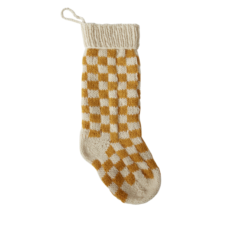 Unleash some festive fun with our Damier Stocking in Mustard Check! This playful stocking features a bold red check print, adding a touch of whimsy to your holiday decor. Bring a touch of quirkiness to your fireplace with this unique stocking.&nbsp;