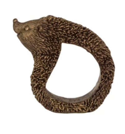 Tie your table setting together with these charming Resin Animal Napkin Rings! Featuring an antique gold finish, these rings add a touch of whimsy to any dining experience. Let these hedgehog rings be the finishing touch to your next dinner party.