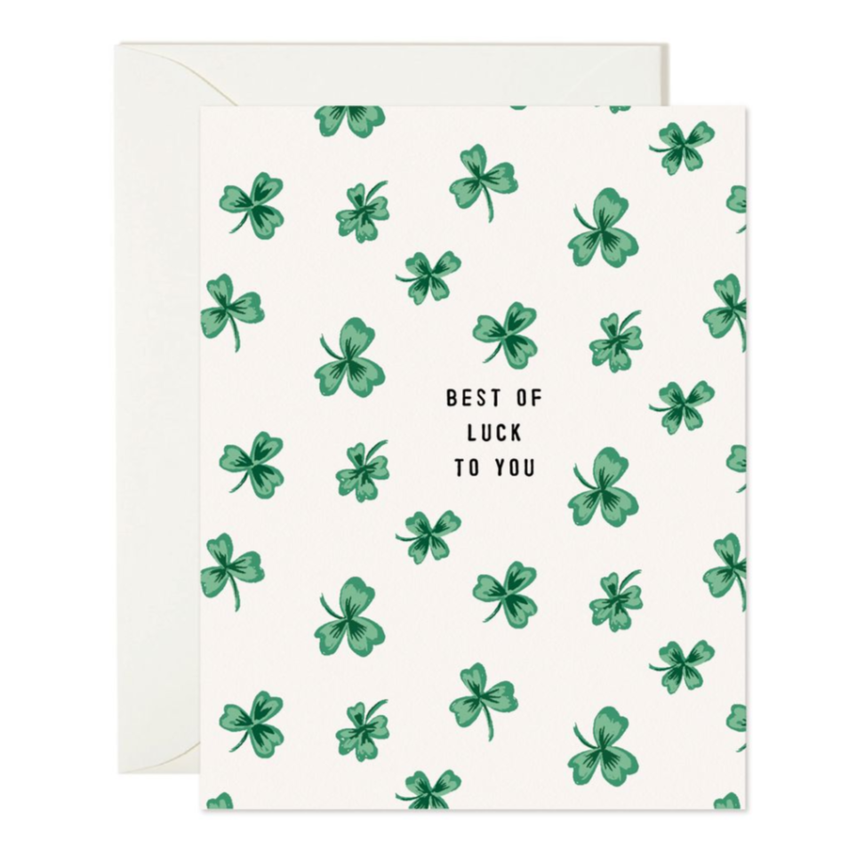 white card with green shamrocks reading "Best of luck to you"