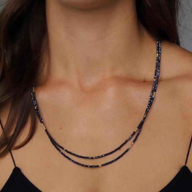 Petite hematite crystal wrap necklace with gold filled accent beads and our signature leaf chain ending. Can be worn as a wrap necklace or bracelet.