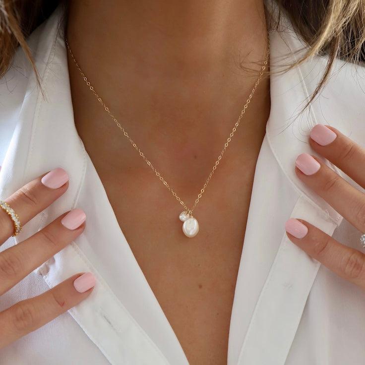 The Double Pearl Drop Necklace is a modern twist to classic pearl styles. The organic shape and sizes are unexpected and eye-catching.