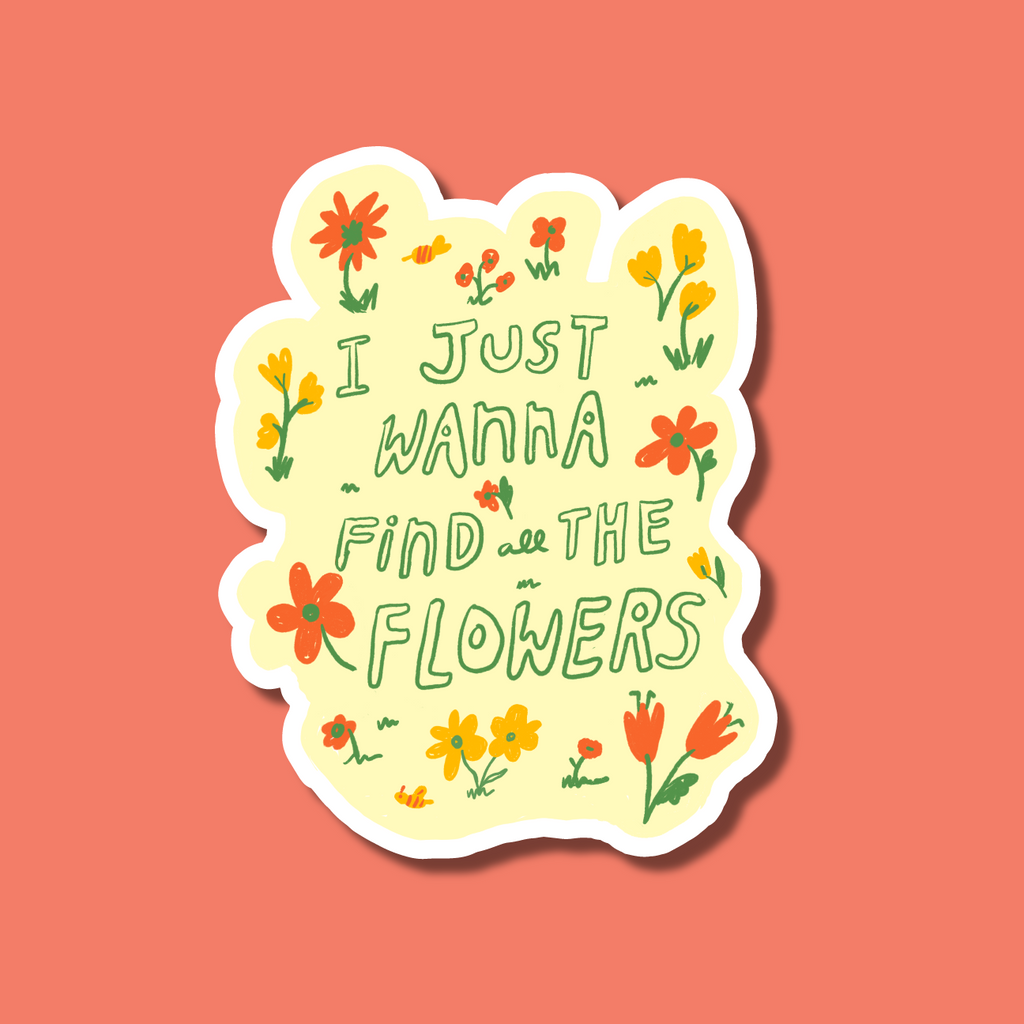 yellow sticker featuring orange and red flowers reading "I just wanna find the flowers"