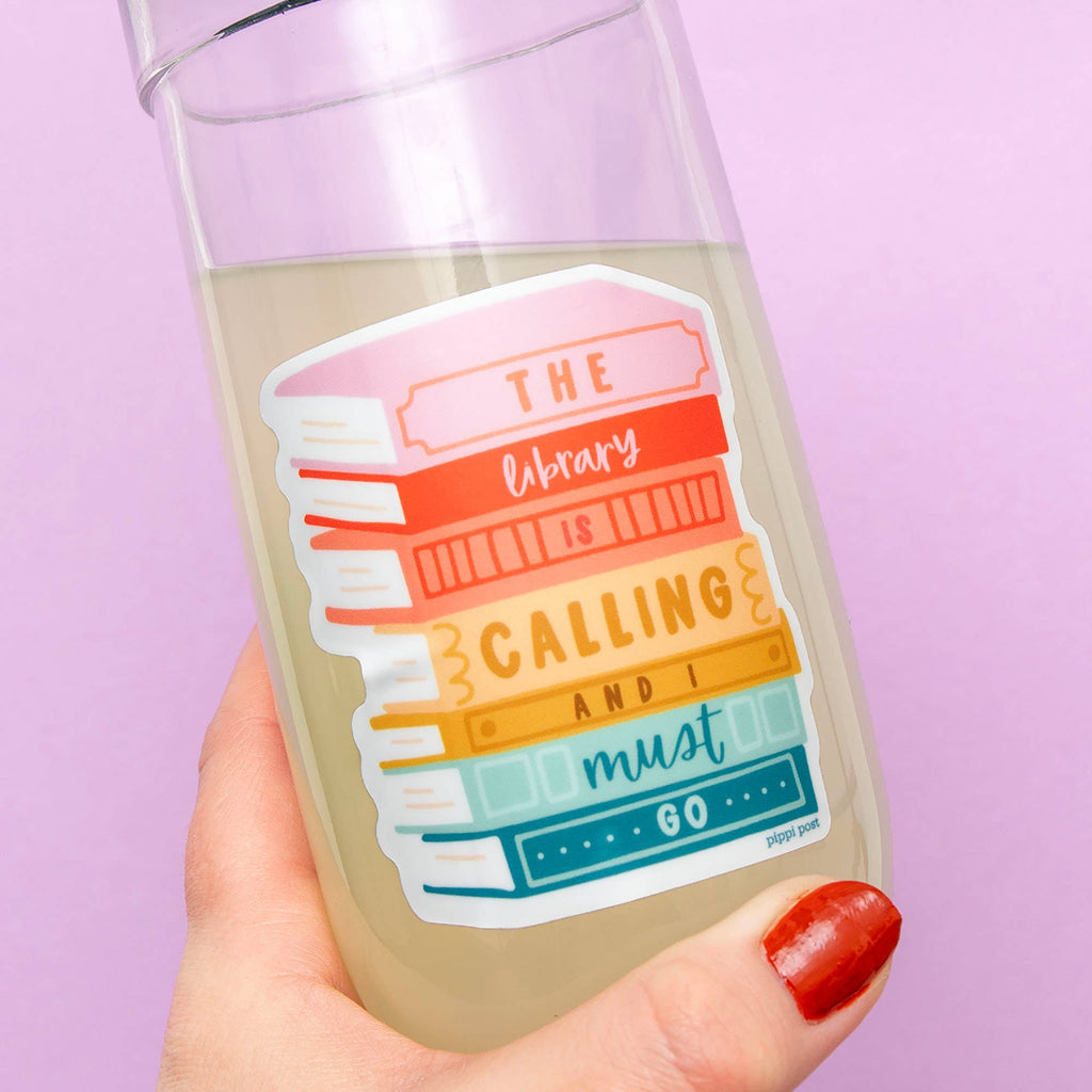 Get ready to show your love for books with The Library is Calling Decal Sticker! This playful sticker is perfect for bookworms who can't resist the call of the library. Stick it on your laptop or water bottle to add a quirky touch to your everyday items.&nbsp;