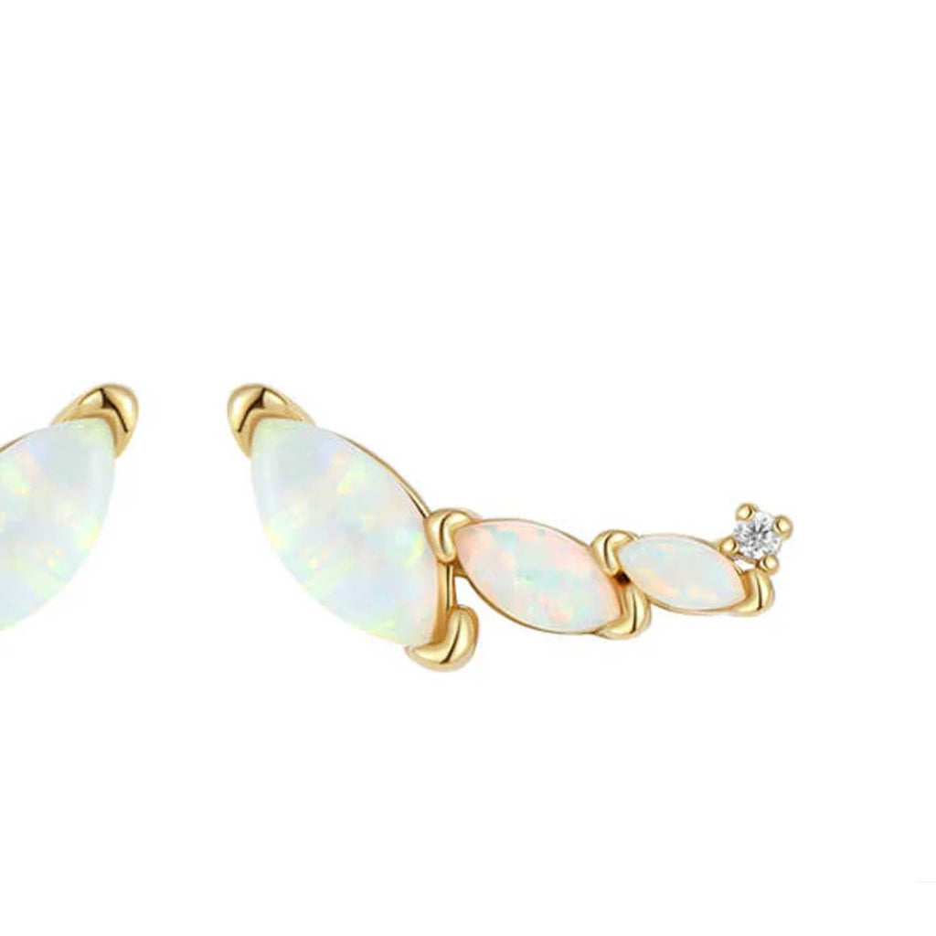 These shimmering opal climbers are named after the groups of stars that move in the same direction within the galaxy. These marquis opals glide at a curve leading to a stunning cz, adding to the brilliance

.925 sterling silver with gold plating
Extra layer of tarnish resistance
Lab created opals
Curated by Mineral and Matter