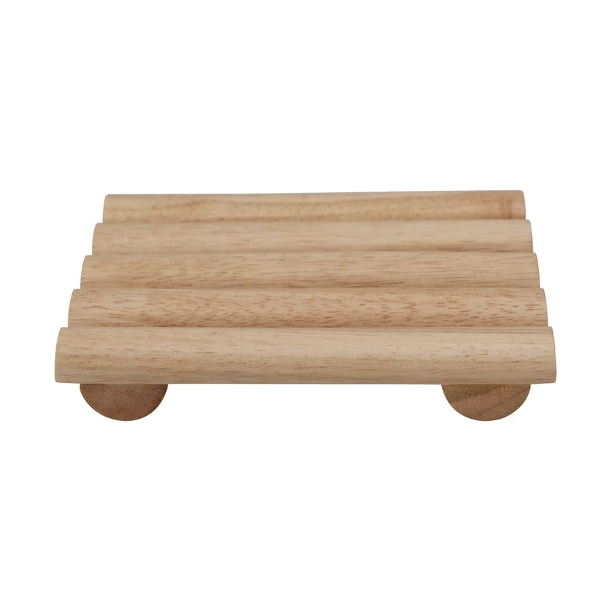 Expertly crafted from 100% natural rubberwood, the Bloomingville Footed Trivet provides a durable and stylish solution for placing dishes and pots on your kitchen counter or dining table. The trivet's generous 7-3/4" x 7" size ensures ample coverage, while its simple, yet elegant design adds a touch of natural beauty to any space.