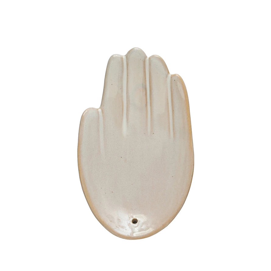 Decorative stoneware hand-shaped incense holder in a cream, reactive glaze color.