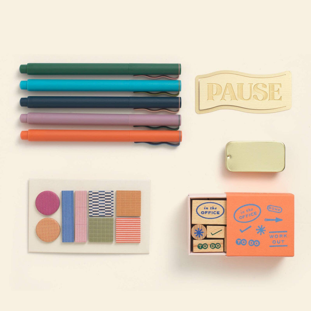 The ideal gift for every passionate organizer. Papier’s Plan &amp; Pause gift set has been created for those that like to keep life coordinated. There’s fineliners to brighten every schedule, sticky tabs and planner stamps to structure every page, and Papier’s golden Pause bookmark so they never lose their place (also perfect for their favorite book too). All assembled in a beautifully designed, desk-worthy box.