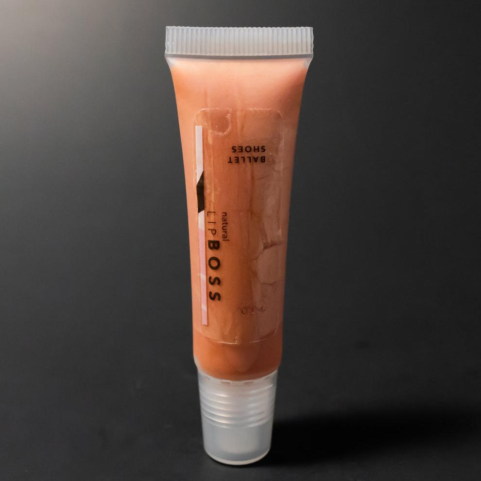 bronze lip product in a squeeze tube