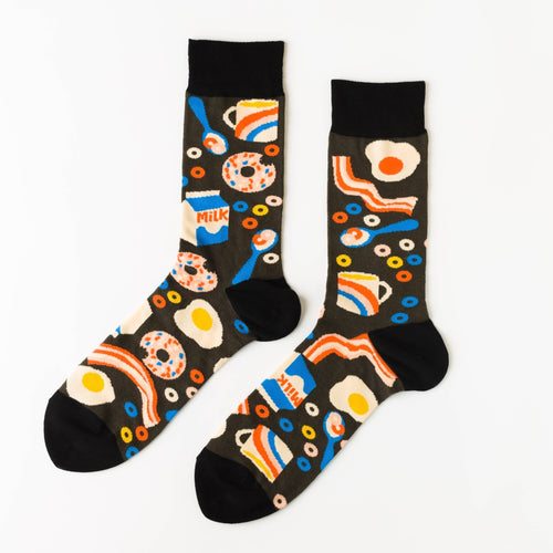 Breakfast? More like breakFEAST! These socks are decorated with all the fixings to a great breakfast or brunch: eggs, bacon, donuts, milk, and cereal. Even better: when you put your feet together, the eggs and bacon line up to create a smiley face.

Wake up in the morning and slide these on to get in the spirit of your first meal immediately or give as a gift to a breakfast-lover or a gift for a fun dad or grandpa on Father's Day. Whoever's wearing these will be dancing their way to the breakfast tab