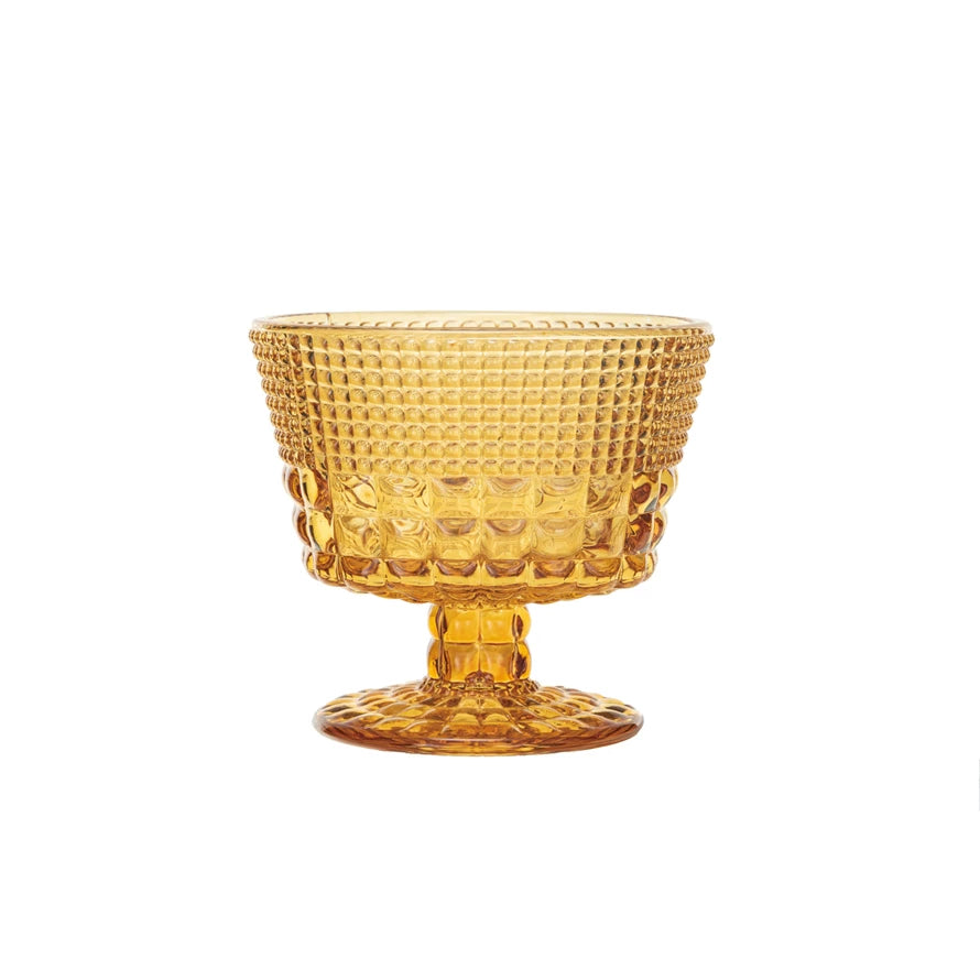 This amber embossed coupe glass is a beautiful and functional addition to the home. The glass features an embossed pattern that creates a textured and refined effect, and an amber color that adds a touch of richness and glamour. The glass can hold up to 14 ounces of cocktail, wine, or champagne, and has a stemmed base for comfort and flair. It is made of clear and amber glass with a smooth and glossy surface. It is easy to clean and dishwasher-safe. The glass measures 4 inches