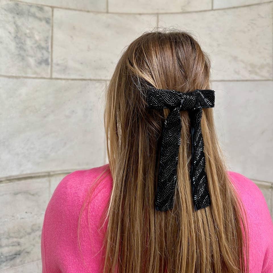 Each hair clip is sewn by hand with meticulously embroidered beads. It features a versatile French barrette closure, for effortless styling.