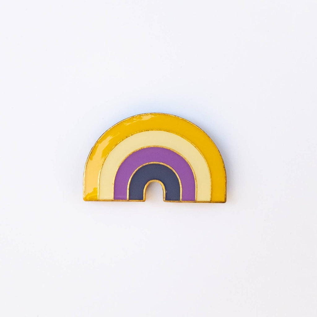 These LGBTQ+ Pride Rainbow pins have an antique brass and glossy epoxy finish for a classy vintage aesthetic. This pin features a retro style non-binary rainbow. Enamel pins are perfect for wearing on jackets, backpacks, bags, and other accessories. They can also be used to decorate pin boards, cork boards, and other surfaces. Enamel pins are also a popular choice for collectors, as they can be used to create a unique and personal collection!  Size: 1.25" soft enamel pin