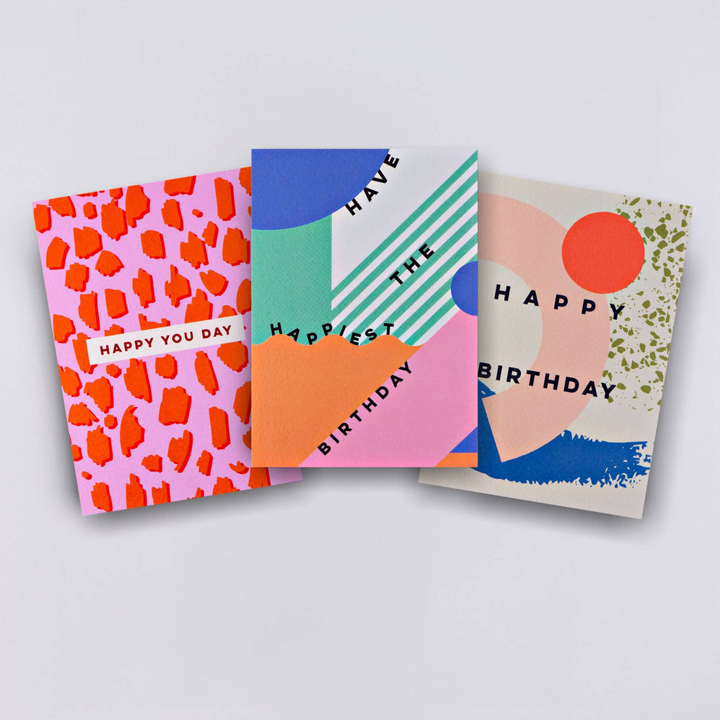 This graphic birthday card set has cards that are blank on the inside, leaving plenty of room for personalized messages! They're A6 cards, printed in the UK on 300gsm FSC certified paper with a hammered texture, which enhances its rich colors. Comes with lilac, green and olive coloured envelopes and are packed in a card box with a window so you can see and feel the lovely card texture. This set of 6 includes 3 designs (our 3 best sellers), 2 of each.