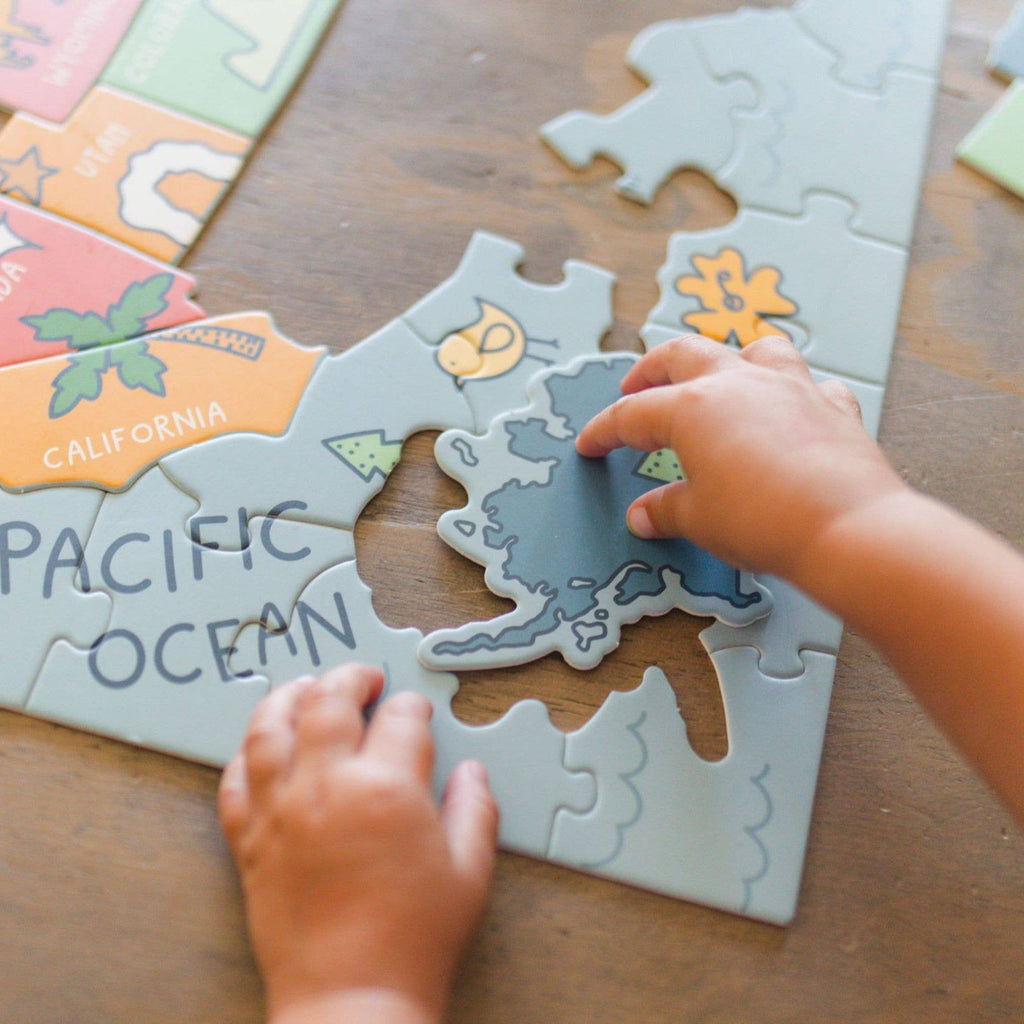 Explore the United States of America with our one-of-a-kind, hand-drawn puzzle. The uniquely state-shaped pieces and beautifully illustrated designs make this puzzle a fun and educational activity for kids and adults alike. With only 110 pieces, it's the perfect gift for children and a great addition to any teacher's classroom.