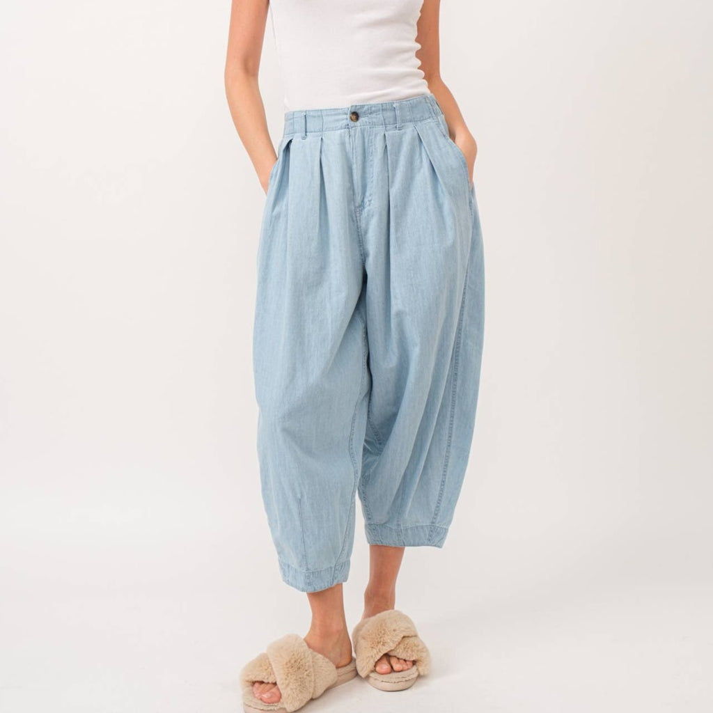 Quinn Pants are crafted from lightweight denim, offering a relaxed fit with a pleated front detail for added flair. The elastic back waist ensures comfort without compromising style.