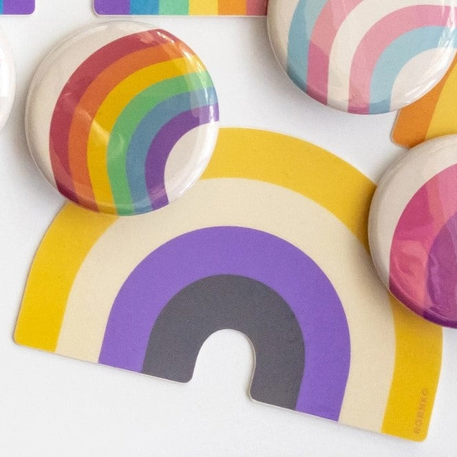 Get ready to show off your pride with these Retro Style Non-Binary Rainbow Stickers! Made with durable vinyl, these stickers are perfect for decorating laptops, water bottles, and more. Show your support for the non-binary community with this fun and colorful accessory.