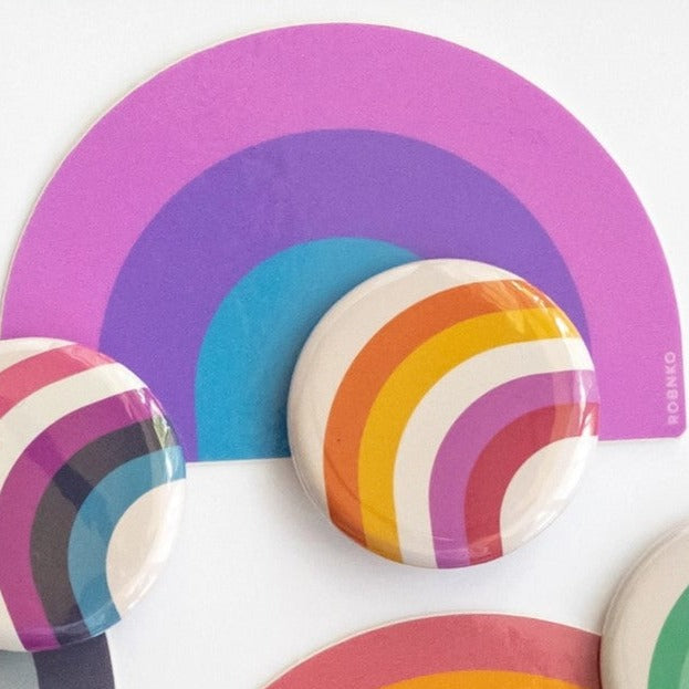 Get ready to show off your pride with these Retro Style Non-Binary Bisexual Rainbow Stickers! Made with durable vinyl, these stickers are perfect for decorating laptops, water bottles, and more. Show your support for the bisexual community with this fun and colorful accessory.