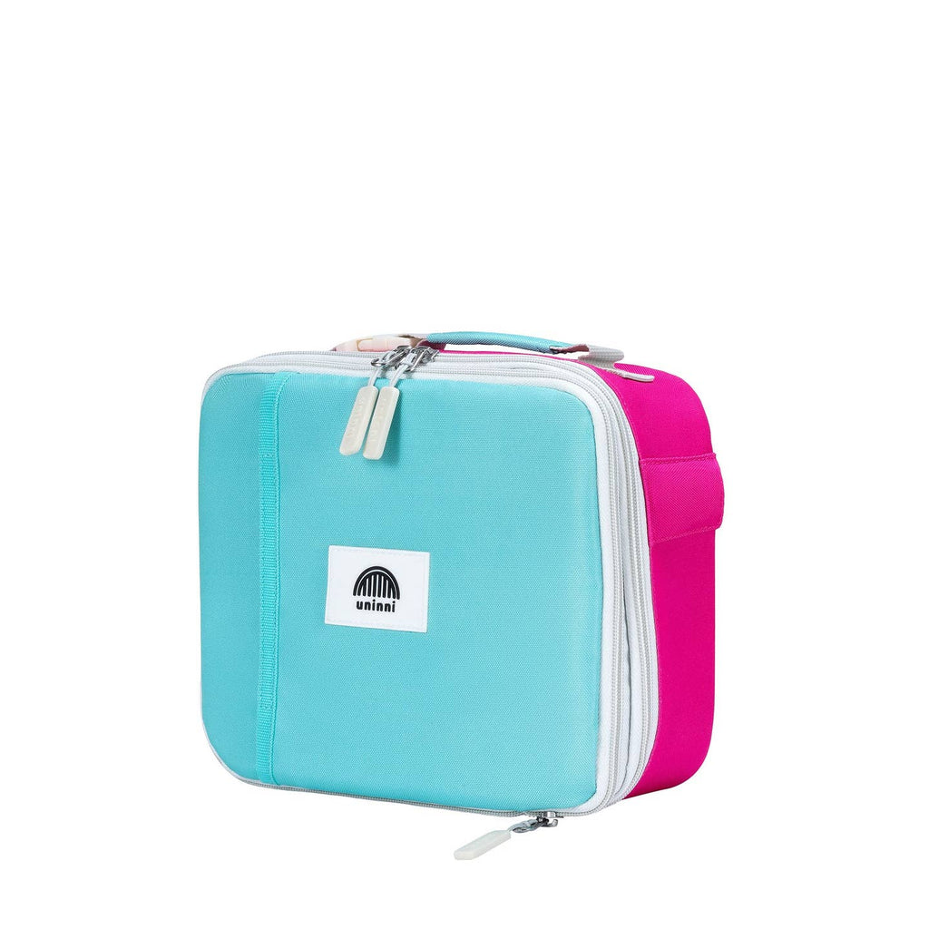 Take flight with the Ellis Lunch Bag in Pink Color Block! This unique lunch bag features a playful pink color block design, perfect for kids or anyone with a sense of adventure. Keep your lunch fresh and cool while showing off your fun personality.