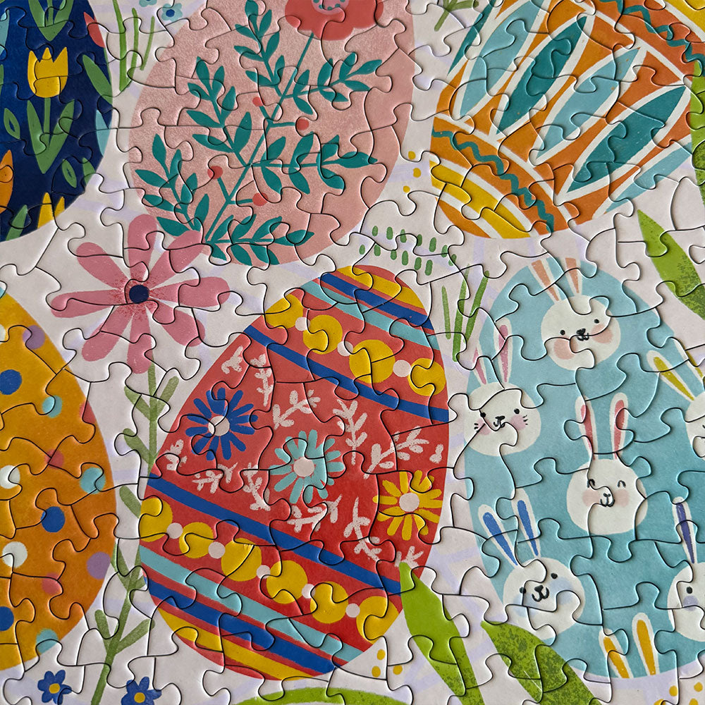 close up of puzzle featuring easter eggs surrounded by florals