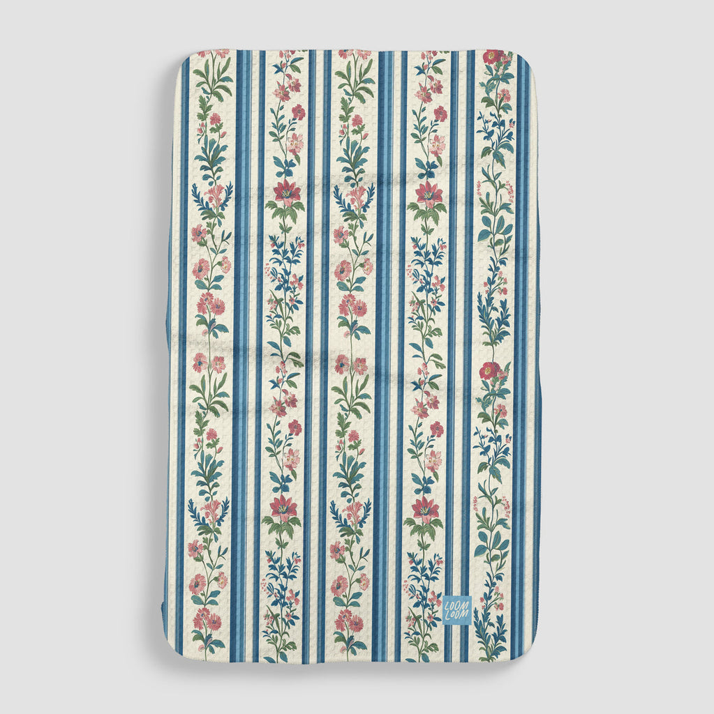 white tea towel with blue stripes and pink floral stripes