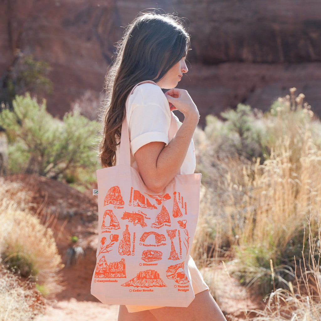 pink and red tote featuring famous landmarks from Utah National Parks and monuments