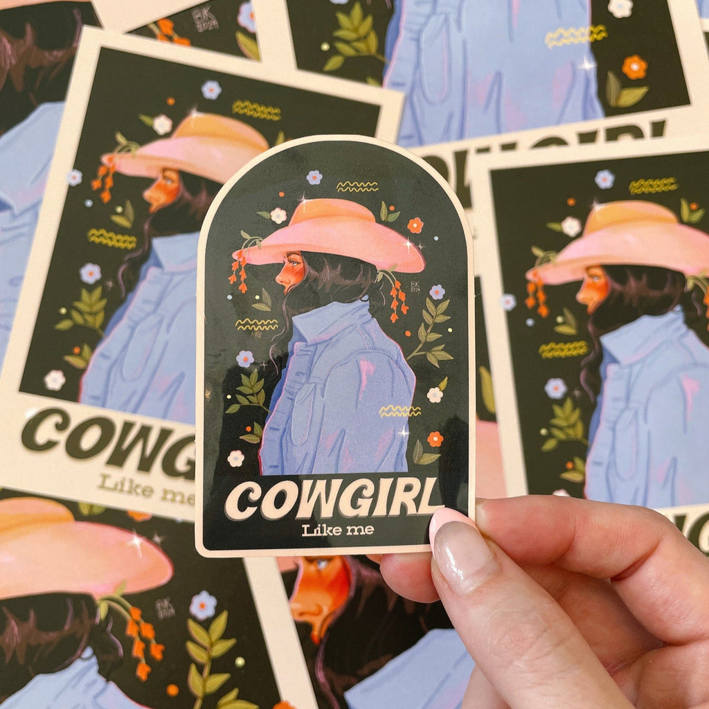 Cowgirl Like Me dark back sticker based off of artwork by Brittany Keller. This sticker has a glossy vinyl finish with a clear background.