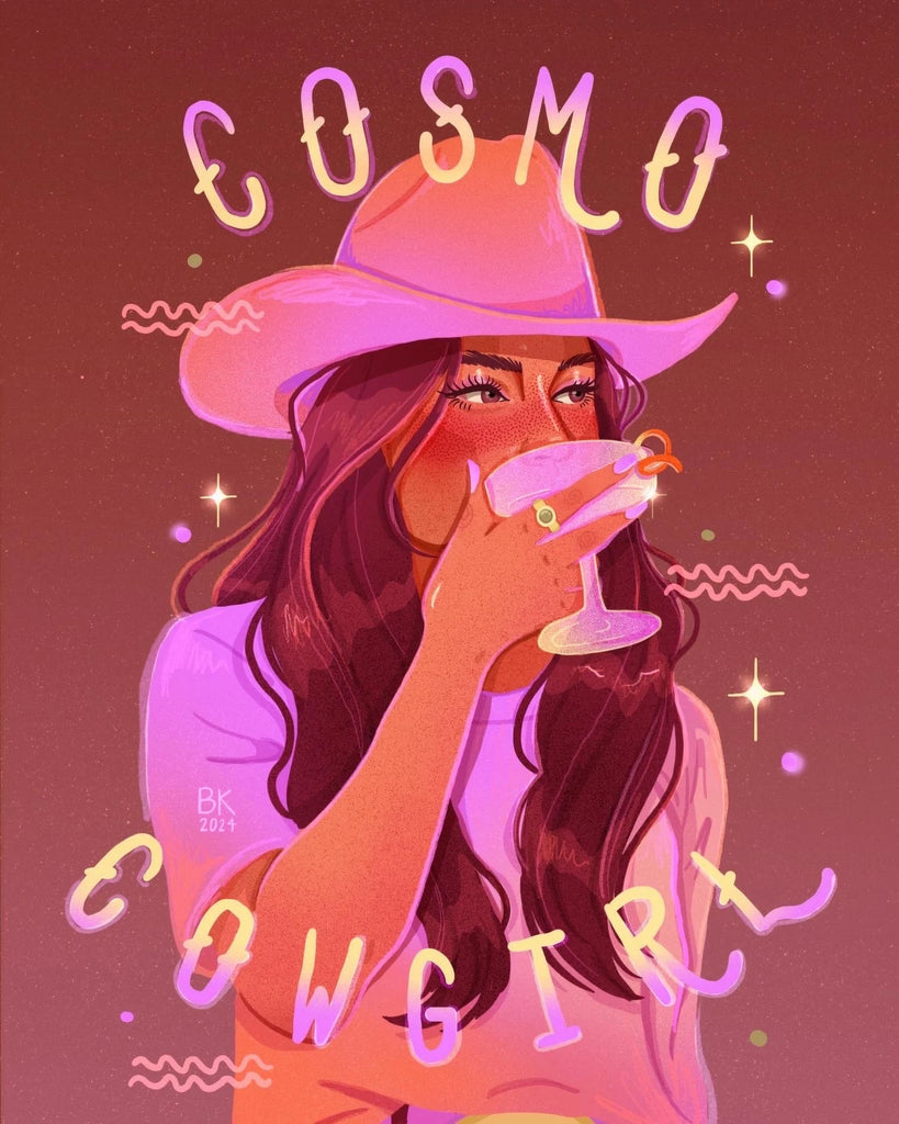 A cowgirl with long brunette hair drinking a cosmo out of a coup. She is wearing a cowgirl hat and a plain t shirt. The print has a pink and purple hue. 