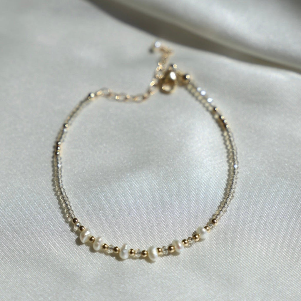 Be the belle of the beach with the Golden Sands Bracelet! A summery accessory made with sand-colored crystals and gold-filled and freshwater pearl beaded accents, this bracelet is just what you need to spruce up your look.