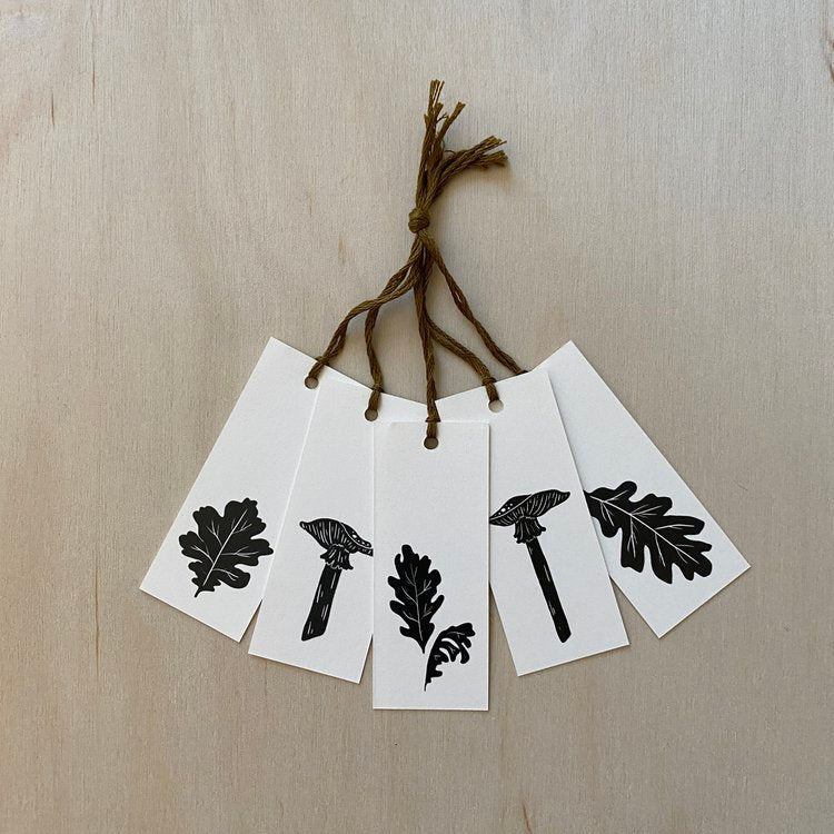 gift tag set featuring mushrooms and leaves with brown thread