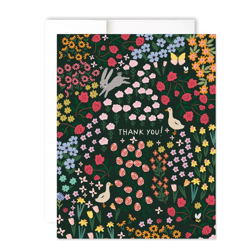 black card featuring a whimsical garden of flowers and creatures. Reading "Thank You!"