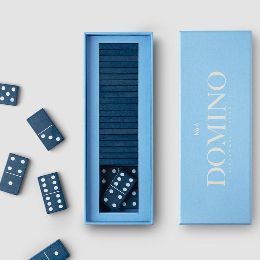 Elevate your Domino set with a new aesthetic twist combining style and entertainment.&nbsp;Our Domino game includes 28 wooden game pieces and easy-to-read English, French, and German instructions. It is recommended for up to 6 players and ages 4+