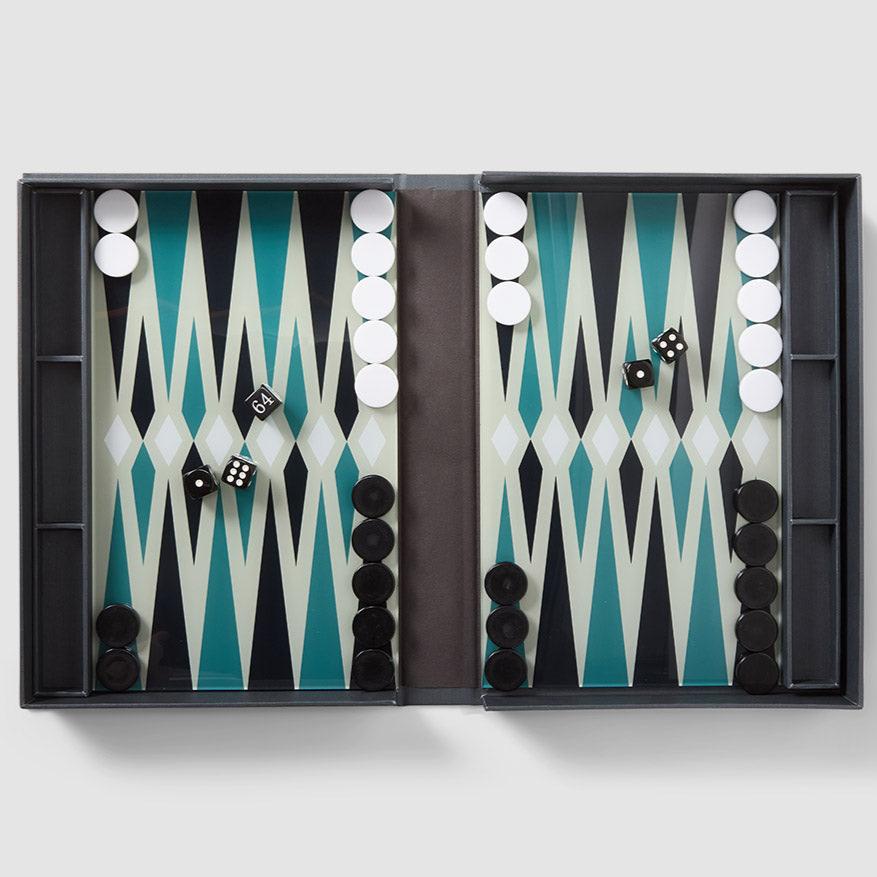 Our "Classic - Backgammon" opens like a book and features a sleek, thin layer of acrylic embellished with intricate patterns, inviting you to enjoy hours of strategic play. It also comes with easy-to-read instructions in English, French, and German. Suitable for two players and recommended for ages 5 and above.