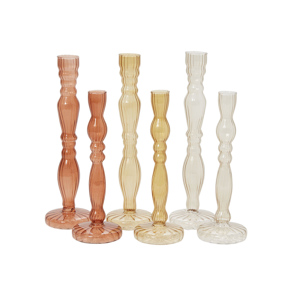 The Raywood Budvase is a delicate ribbed glass budvase in beautiful colors, perfect for a holiday table. Shades of warm yellow are sprayed onto the budvases for a translucent and beautiful finish. Each footed budvase can also be used to hold a taper candle