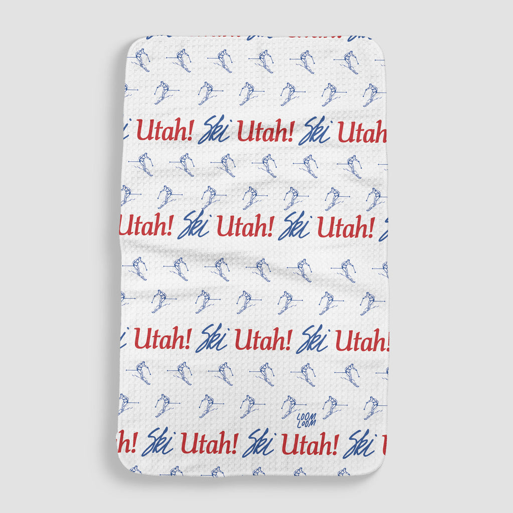 white tea towel with the iconic Ski Utah license plate logo