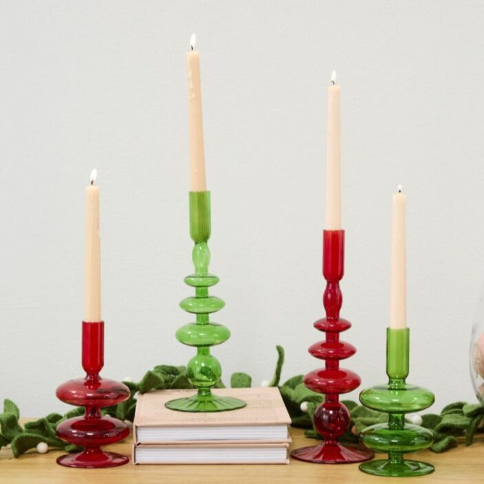 Add a touch of magic to your décor with this wizard candlestick in a playful shade of red. Perfect for casting a warm and enchanting glow in any room, this quirky candlestick is sure to spark conversations and add a whimsical touch to your space.