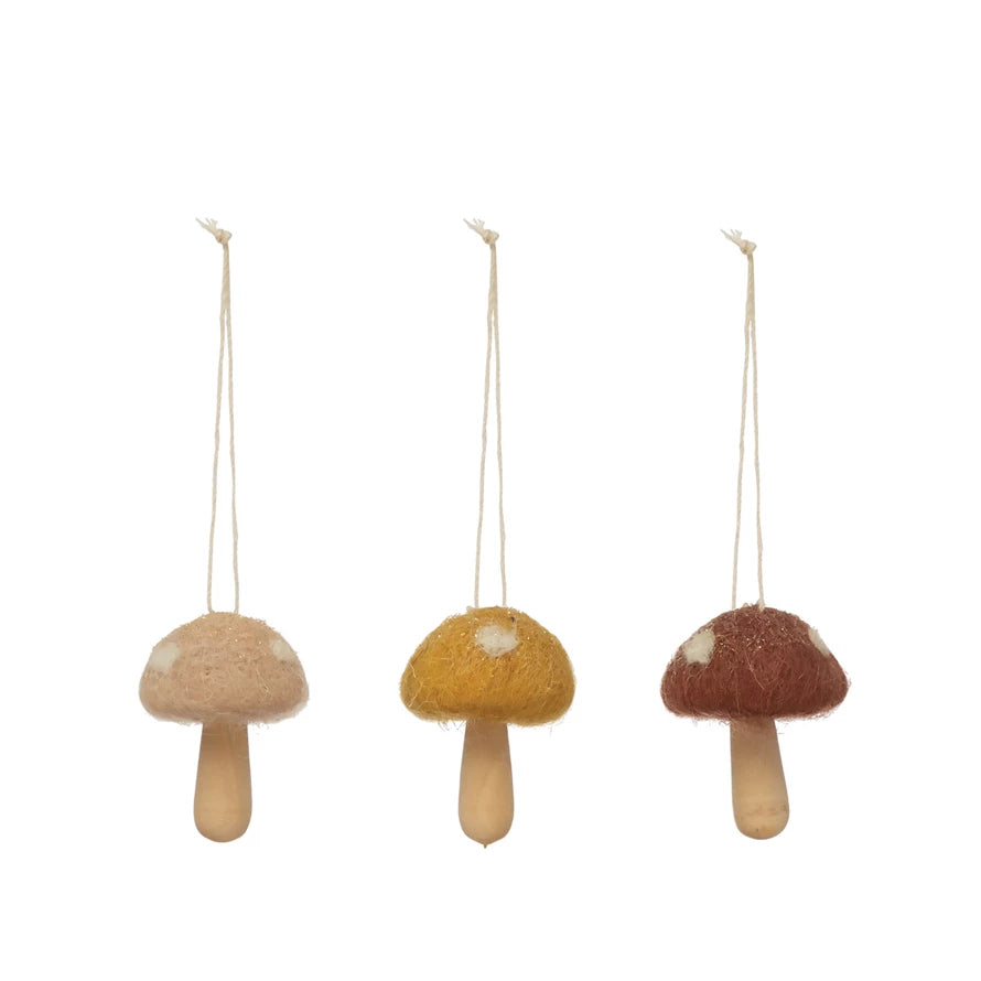 This unique 'shroom is ready for a life with you! Brighten up your space with this adorable 2"H Wool and Wood Mushroom Ornament in three eye-catching colors – a perfect mix of traditional and modern!     Size  2"H   Materials  40% Wool, 40% Polyfoam, 20% Theaceae