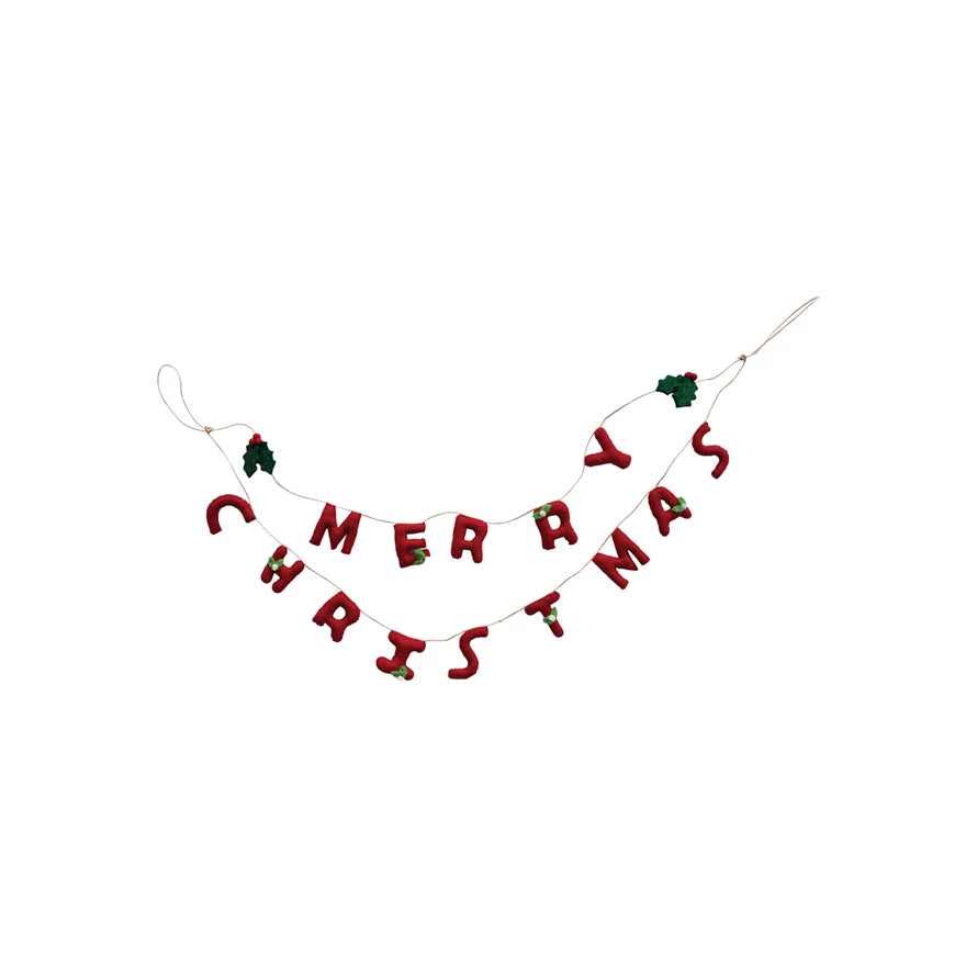 This handcrafted garland is a celebration of the holiday spirit, featuring lush wool felt holly leaves and bright red berries that spell out "Merry Christmas". Each element is meticulously created to bring a piece of the holiday cheer into the home.