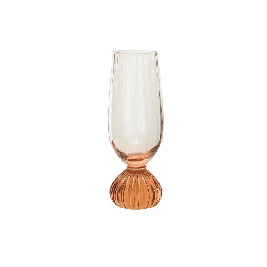 This pink ribbed champagne glass is a beautiful and functional addition to any glassware collection. The glass features a ribbed texture that creates a visual and tactile appeal and a pink tint that adds a touch of warmth and glamour. The glass can hold up to 8 ounces of bubbly drink and has a footed base for stability and style. It is made of clear and pink glass with a smooth and glossy surface. It is easy to clean and dishwasher-safe.&nbsp;