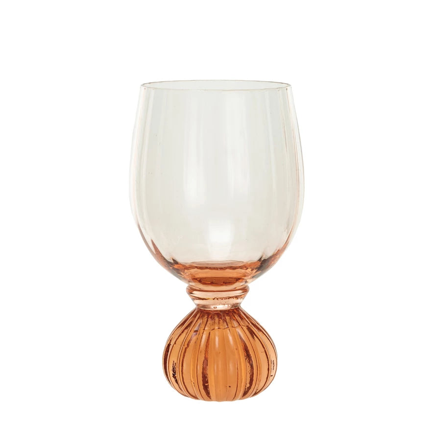 This pink ribbed wine glass is a beautiful and functional addition to any glassware collection. The glass features a ribbed texture that creates a visual and tactile appeal and a pink tint that adds a touch of warmth and glamour. The glass can hold up to 14 ounces of yummy drink and has a footed base for stability and style. It is made of clear and pink glass with a smooth and glossy surface. It is easy to clean and dishwasher-safe.