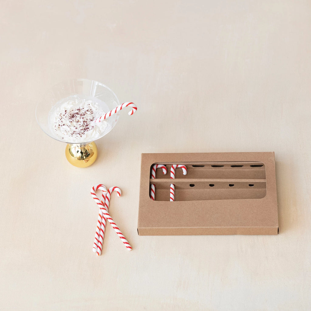 This charming set of 6 glass stir sticks is shaped like the iconic candy cane, instantly evoking the warmth of the holiday season. Each stick is carefully crafted from glass, featuring a classic red and white stripe design that's sure to stir up both nostalgia and the drink.